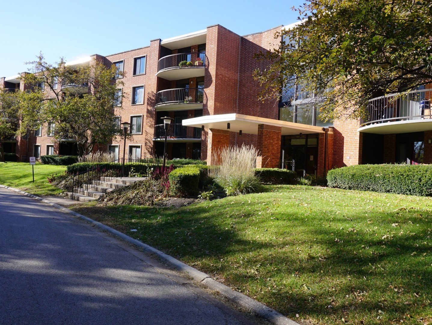 1615 East Central Road, Unit 417C Arlington Heights, IL 60005 - Photo 1 of 23 a view of a house with a yard