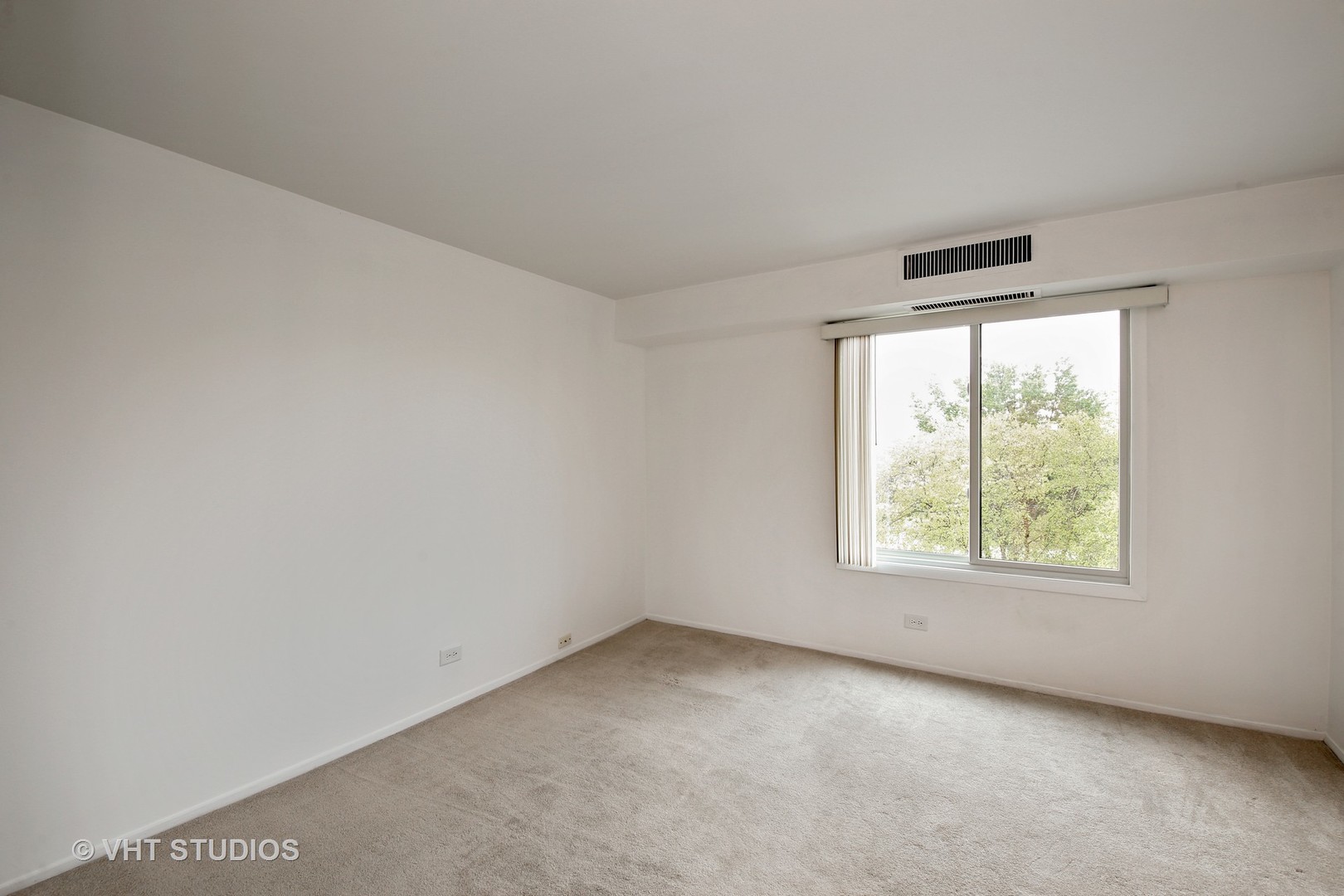 1615 East Central Road, Unit 417C Arlington Heights, IL 60005 - Photo 13 of 23 an empty room with windows
