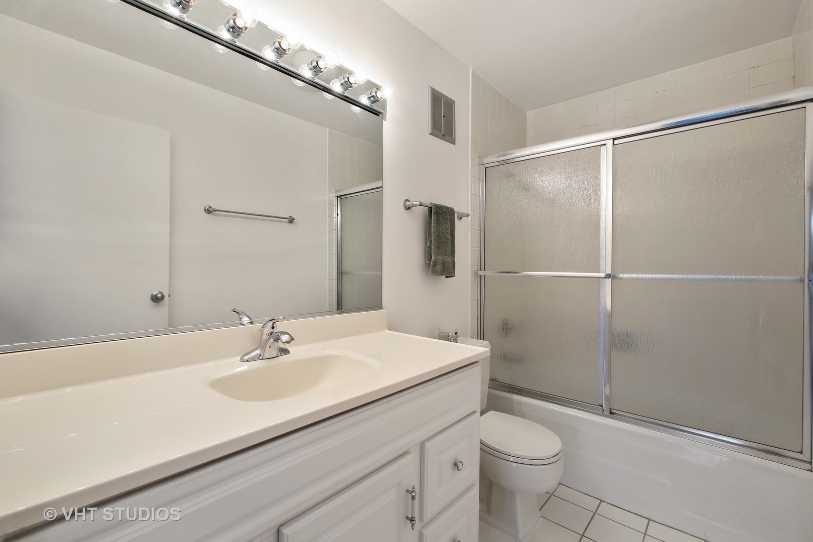 1615 East Central Road, Unit 417C Arlington Heights, IL 60005 - Photo 14 of 23 a bathroom with a sink toilet and shower