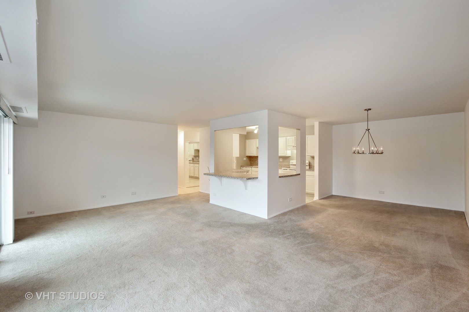 1615 East Central Road, Unit 417C Arlington Heights, IL 60005 - Photo 5 of 23 an empty room with a bathroom and a shower