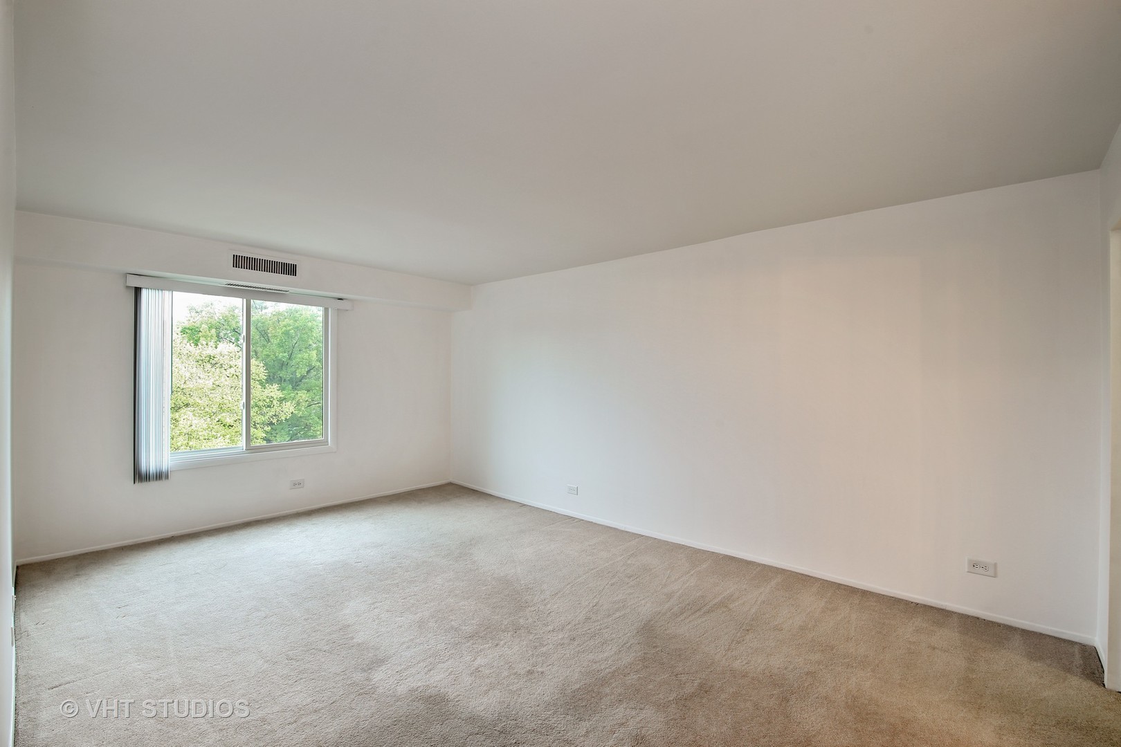 1615 East Central Road, Unit 417C Arlington Heights, IL 60005 - Photo 10 of 23 an empty room with windows