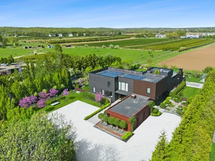an aerial view of a house with a garden