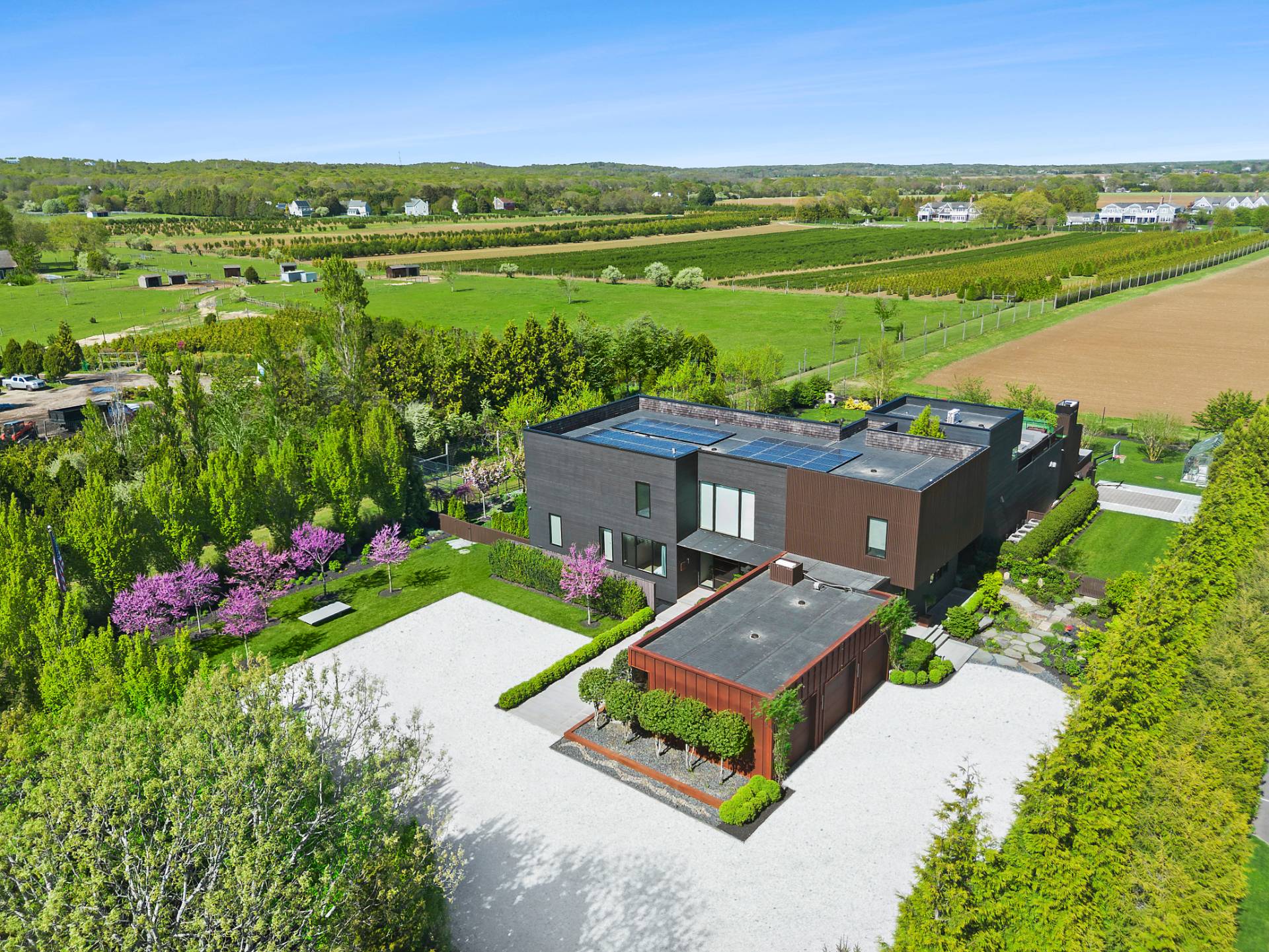 an aerial view of a house with a garden