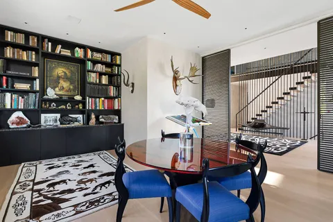 a front view of a house with garden and patio