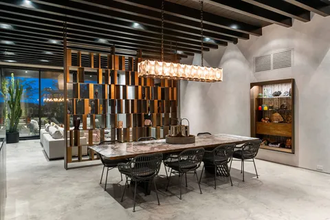 a bedroom with furniture and large window