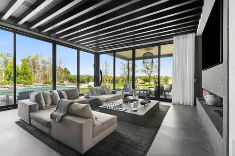 a spacious bedroom with a large bed and a large window