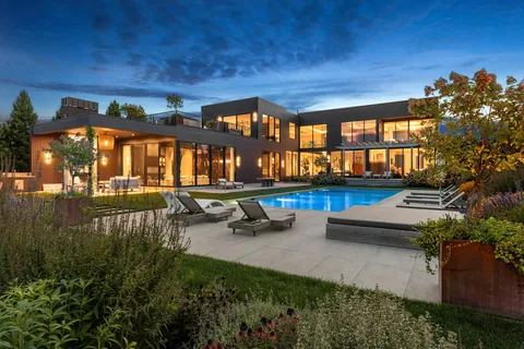 a view of a house with a yard and a garage