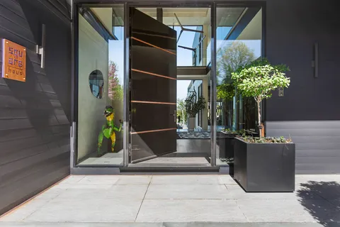 a view of entryway with furniture and wooden floor