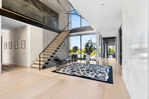 a dining room with furniture and wooden floor
