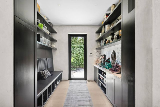 a view of an outdoor dining space with a table and chairs