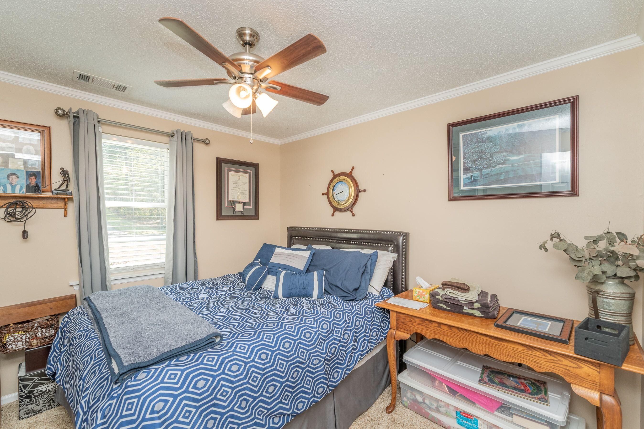 1117 Ridgemont Drive Aiken, SC 29803 - Photo 17 of 49 a bedroom with furniture and window