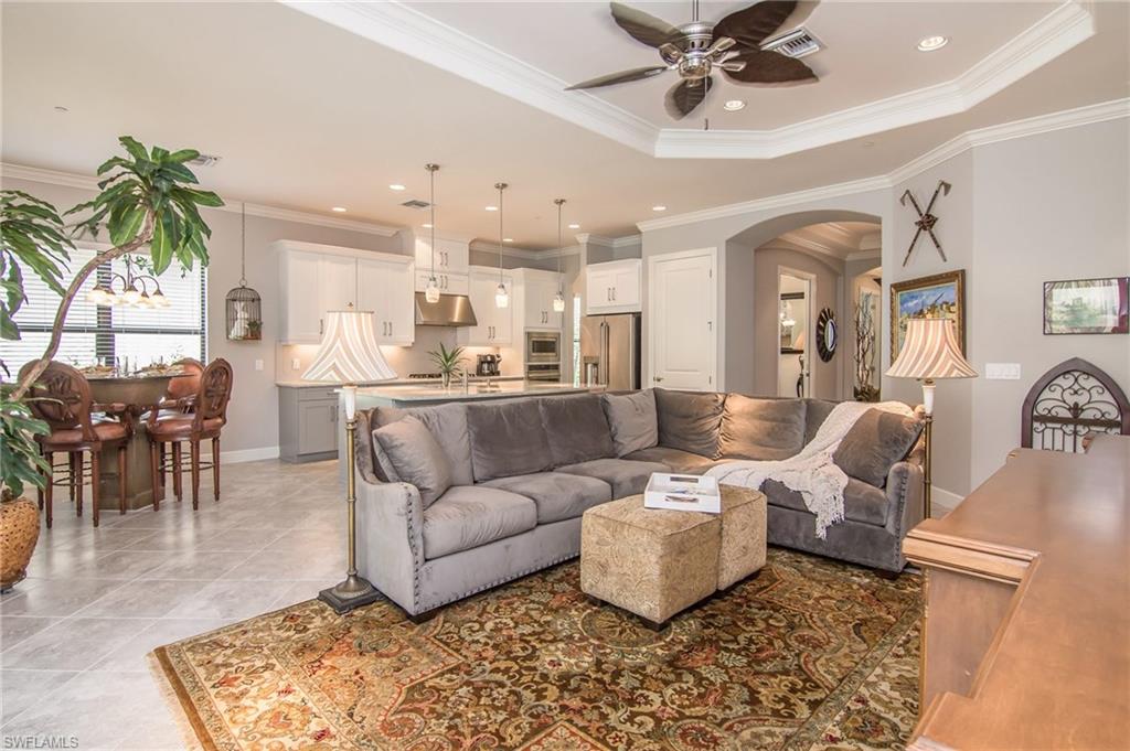 10249 Coconut Road Estero, FL 34135 - Photo 12 of 27 a living room with furniture and a chandelier
