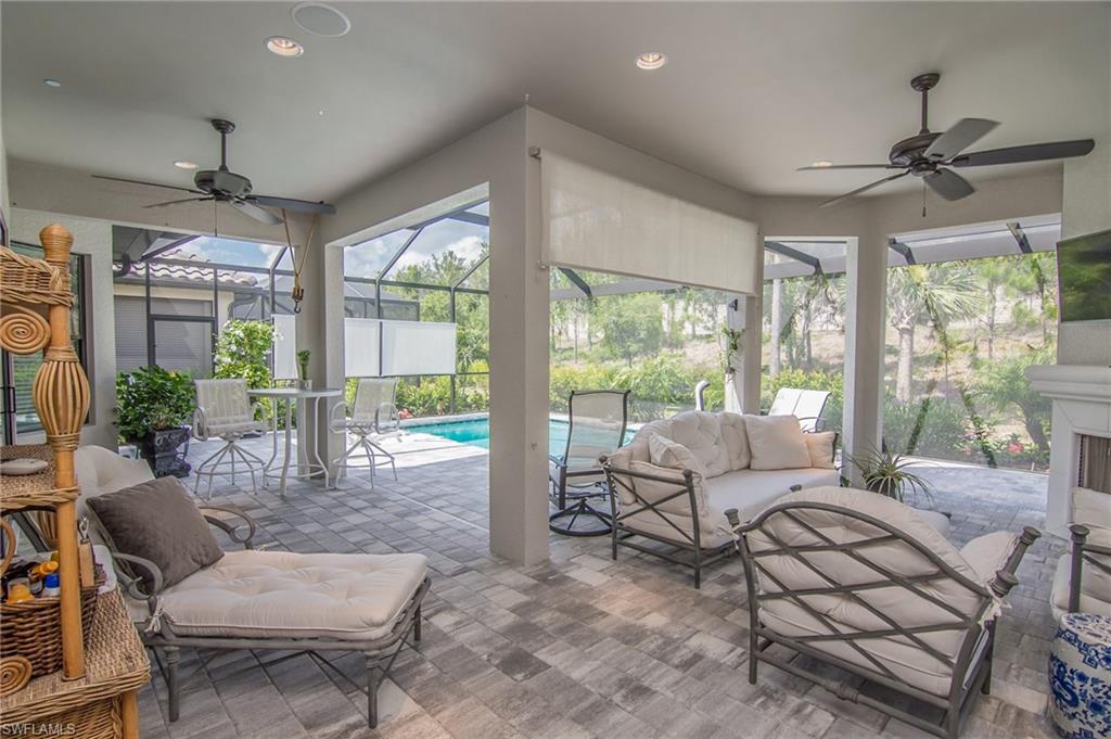 10249 Coconut Road Estero, FL 34135 - Photo 25 of 27 a living room with furniture and a large window