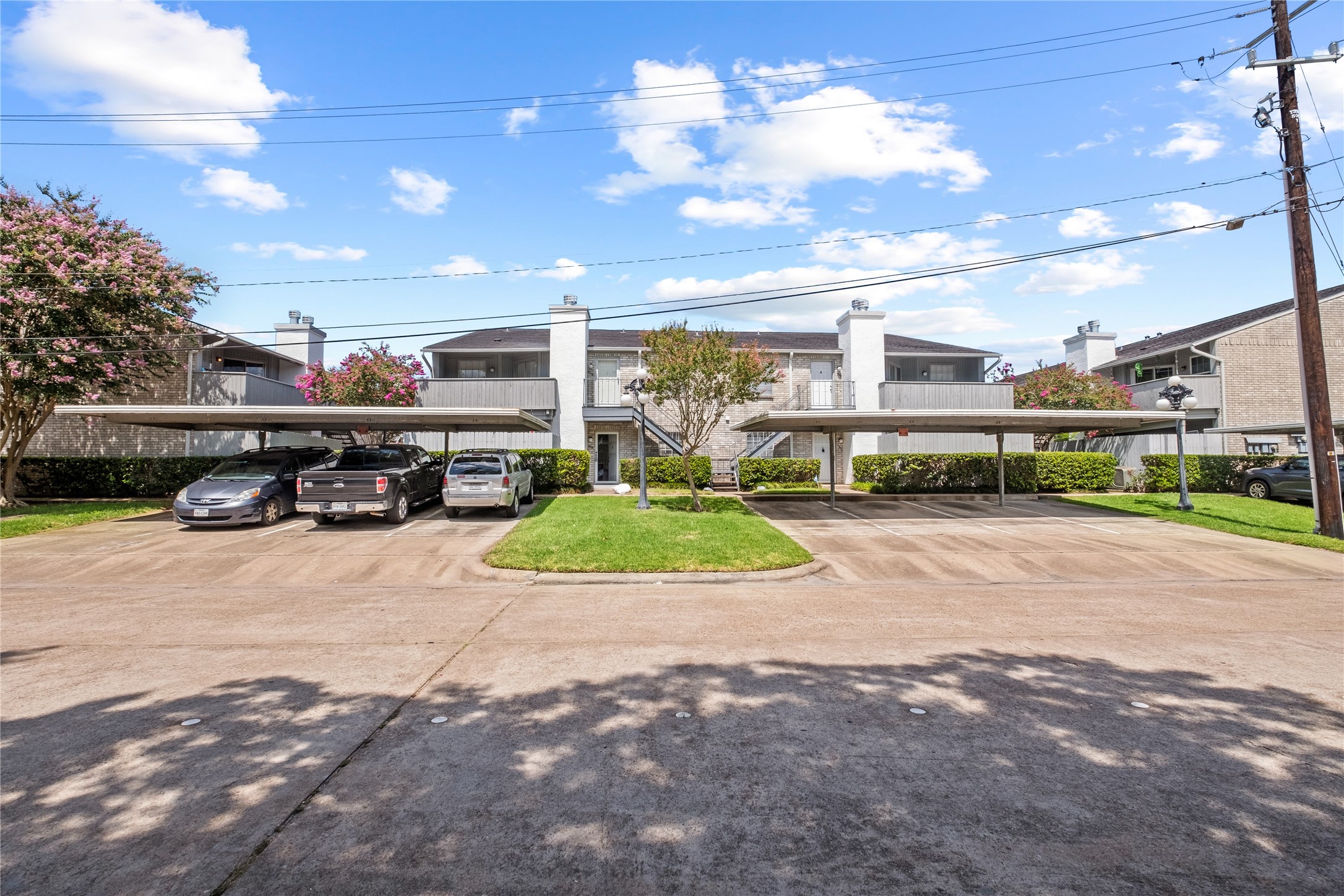 8787 Brae Acres Road, Unit 903 Houston, TX 77074 - Photo 15 of 15 a view of a street with a car parked on the road