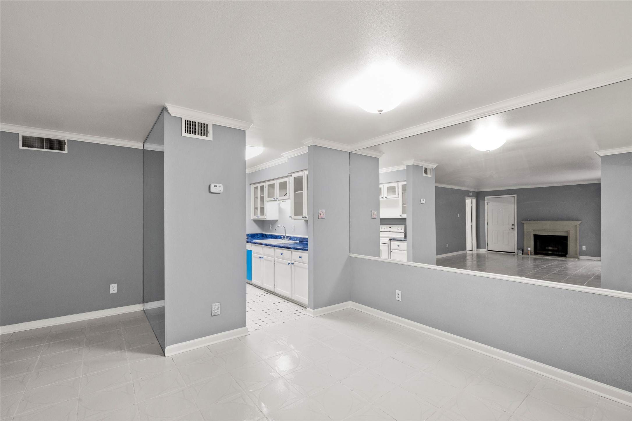 8787 Brae Acres Road, Unit 903 Houston, TX 77074 - Photo 2 of 15 a view of an empty room with a fireplace and windows