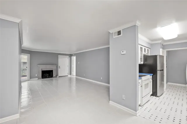 a view of a livingroom with a fireplace and chandelier
