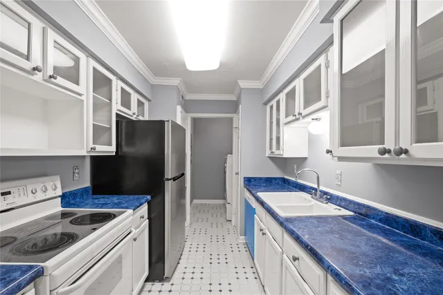 a kitchen with a sink stove and refrigerator