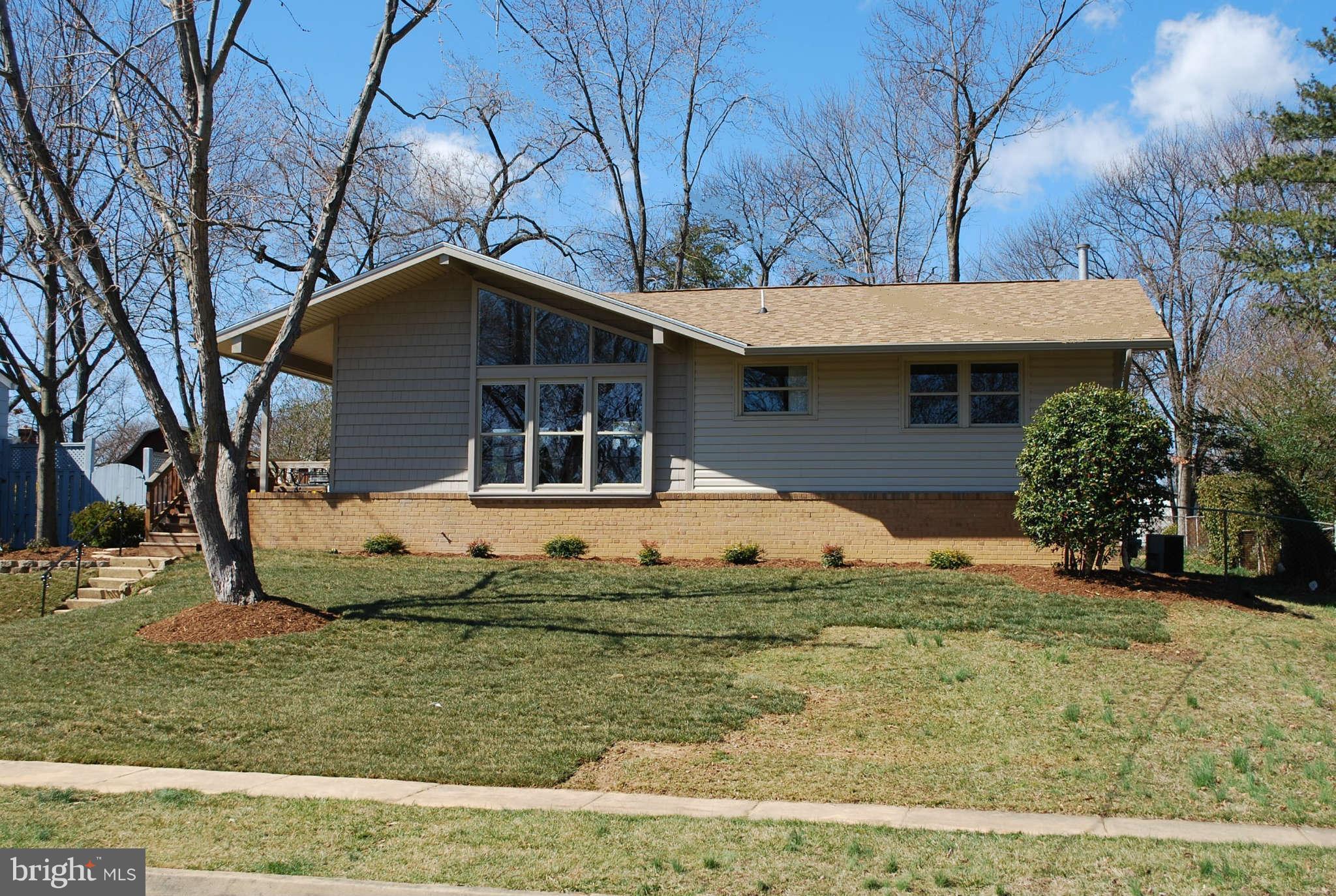 6020 Frontier Drive Springfield, VA 22150 - Photo 1 of 12 a front view of a house with a yard