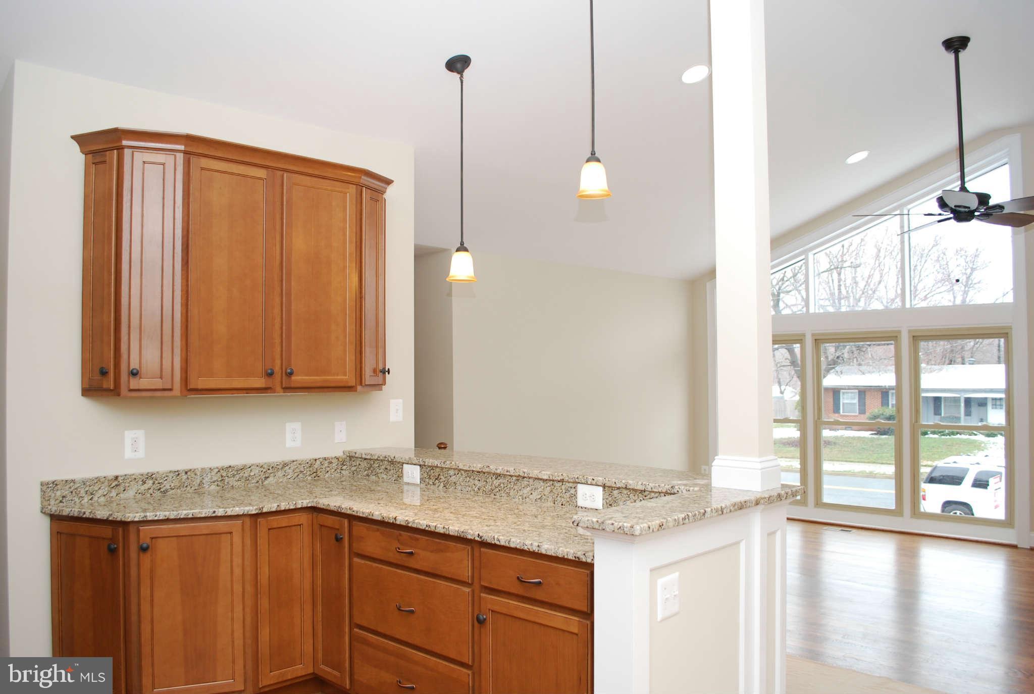 6020 Frontier Drive Springfield, VA 22150 - Photo 4 of 12 a kitchen with granite countertop cabinets and window