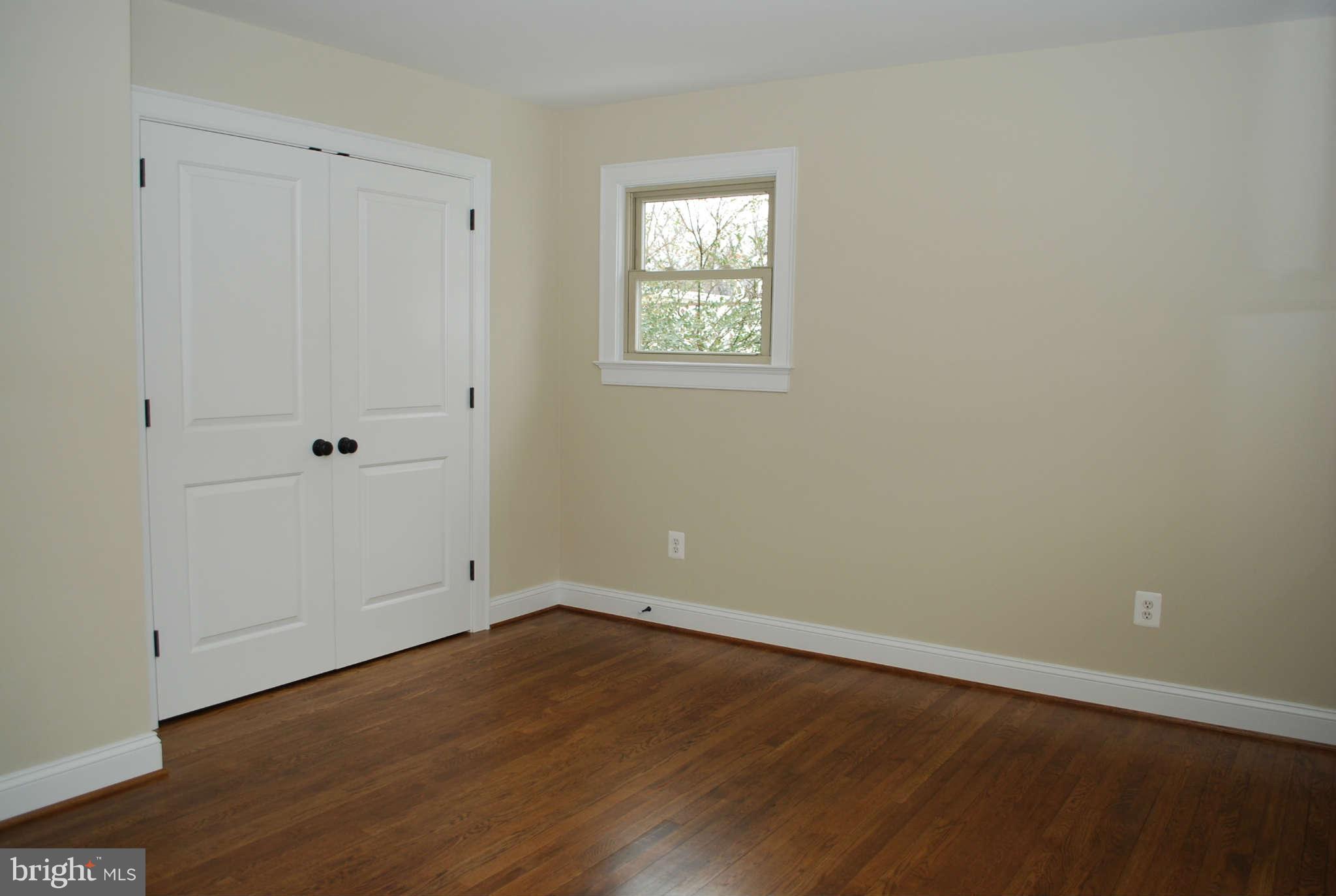 6020 Frontier Drive Springfield, VA 22150 - Photo 6 of 12 a view of room with wooden floor and window