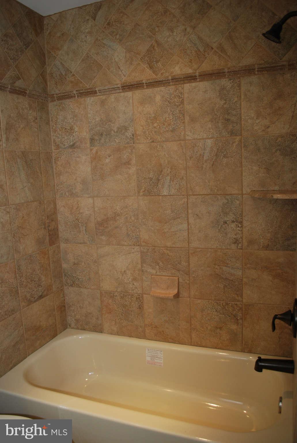 6020 Frontier Drive Springfield, VA 22150 - Photo 9 of 12 a bathroom with a bathtub