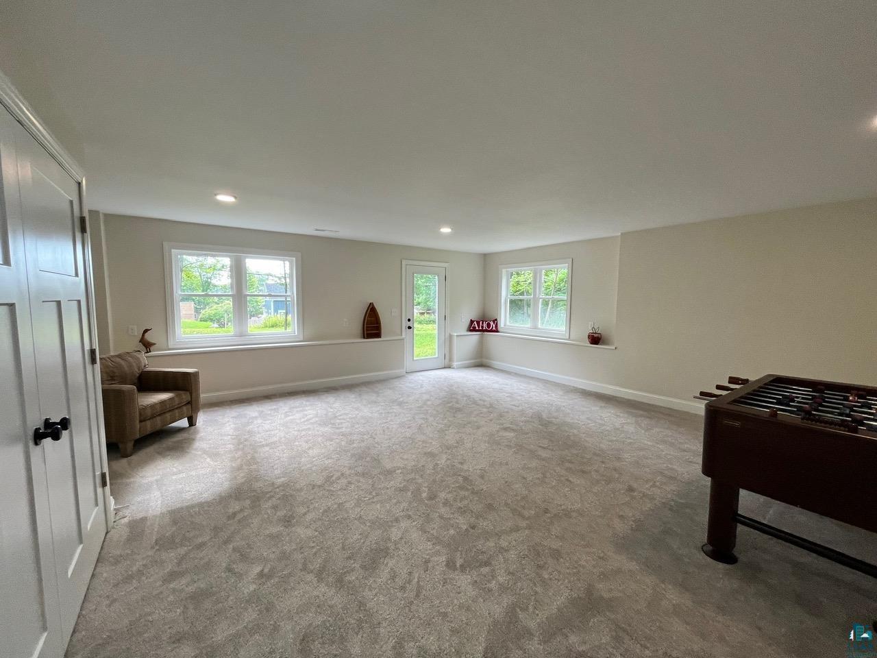 2 8th Street Bayfield, WI 54814 - Photo 13 of 24 Recreation room with carpet floors and recessed lighting