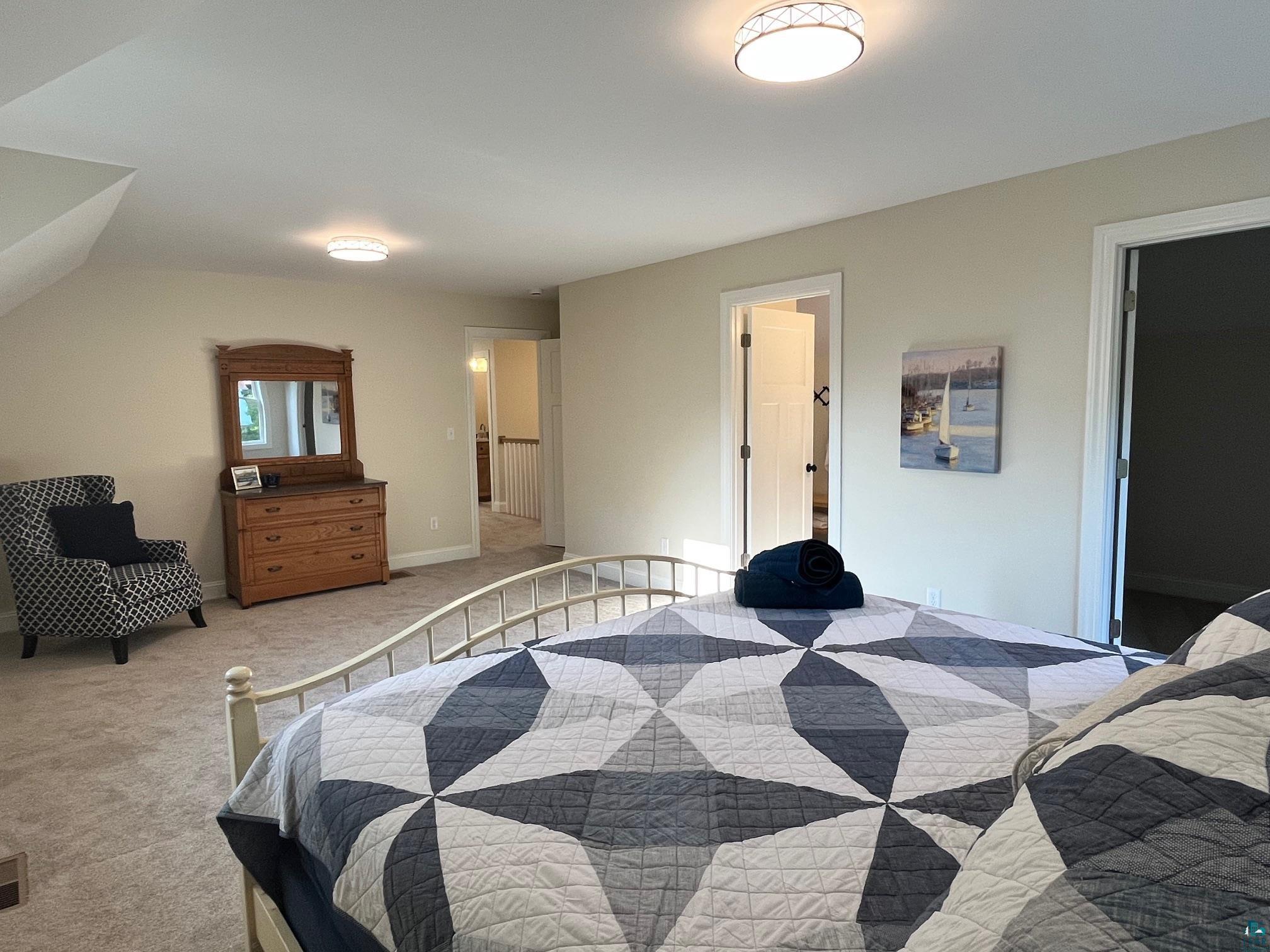 2 8th Street Bayfield, WI 54814 - Photo 7 of 24 Bedroom with light carpet and baseboards