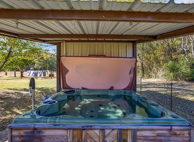 a room with wooden floor and outdoor seating