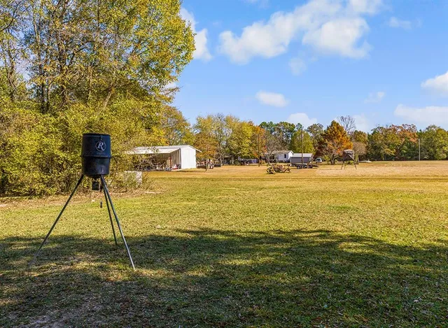 a front view of a house with swimming pool yard and outdoor seating