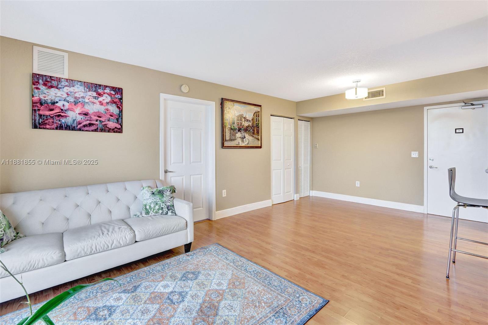 816 Northwest 11th Street, Unit 905 Miami, FL 33136 - Photo 2 of 14 a living room with furniture and a couch