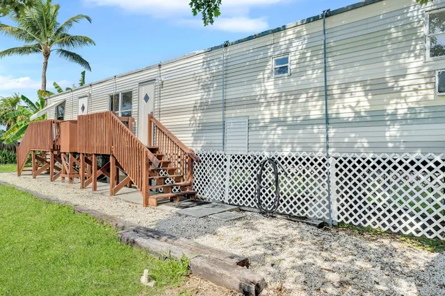 a backyard of a house with wooden fence