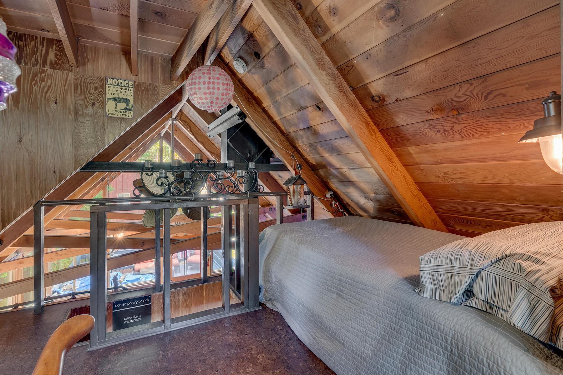 2575 Owl Lane Homewood, CA 96141 - Photo 7 of 20 a bed sitting in a bedroom next to a window