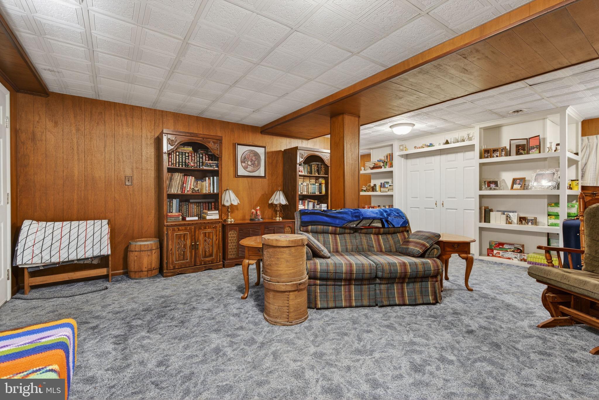 960 Nissley Road Lancaster, PA 17601 - Photo 12 of 24 a living room with furniture and a book shelf