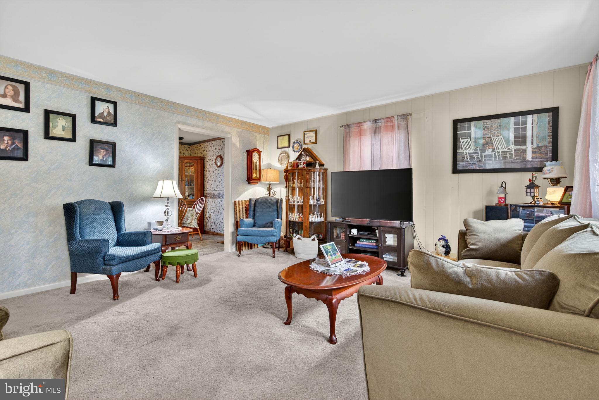 960 Nissley Road Lancaster, PA 17601 - Photo 17 of 24 a living room with furniture and a flat screen tv