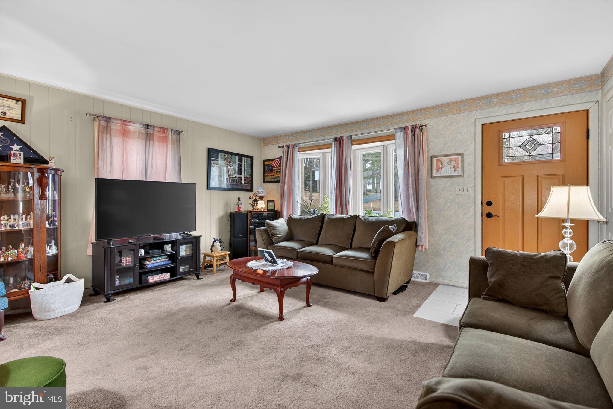 960 Nissley Road Lancaster, PA 17601 - Photo 4 of 24 a living room with furniture and a flat screen tv