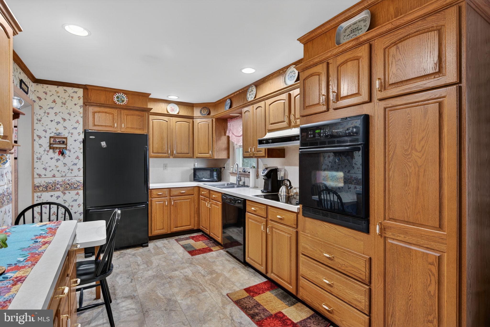 960 Nissley Road Lancaster, PA 17601 - Photo 6 of 24 a kitchen with a refrigerator and cabinets