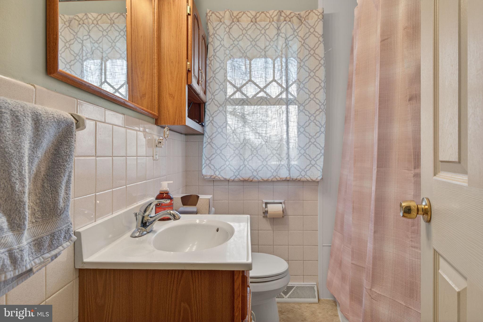 960 Nissley Road Lancaster, PA 17601 - Photo 10 of 24 a bathroom with a sink toilet and mirror
