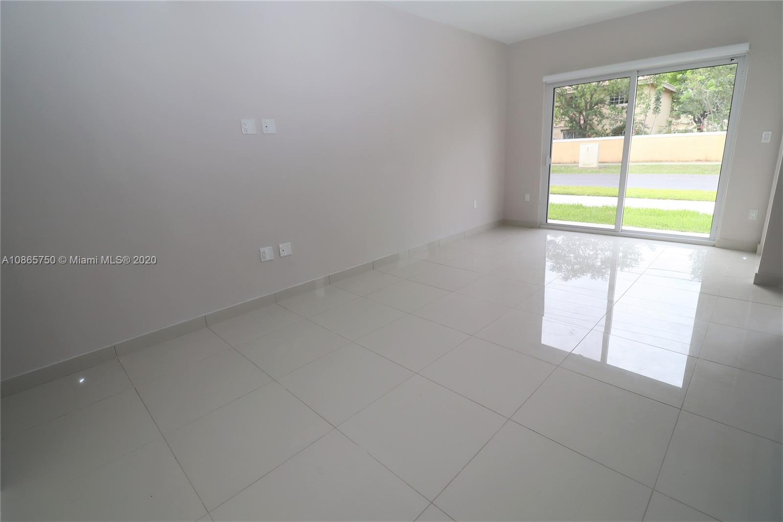 13966 Southwest 259th Terrace Homestead, FL 33032 - Photo 11 of 27 a view of an empty room with a window