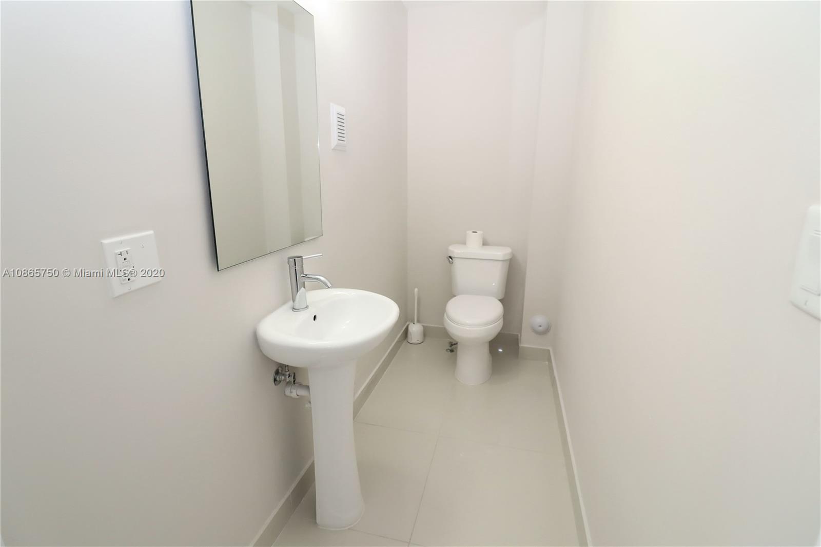 13966 Southwest 259th Terrace Homestead, FL 33032 - Photo 12 of 27 a bathroom with a sink and a toilet