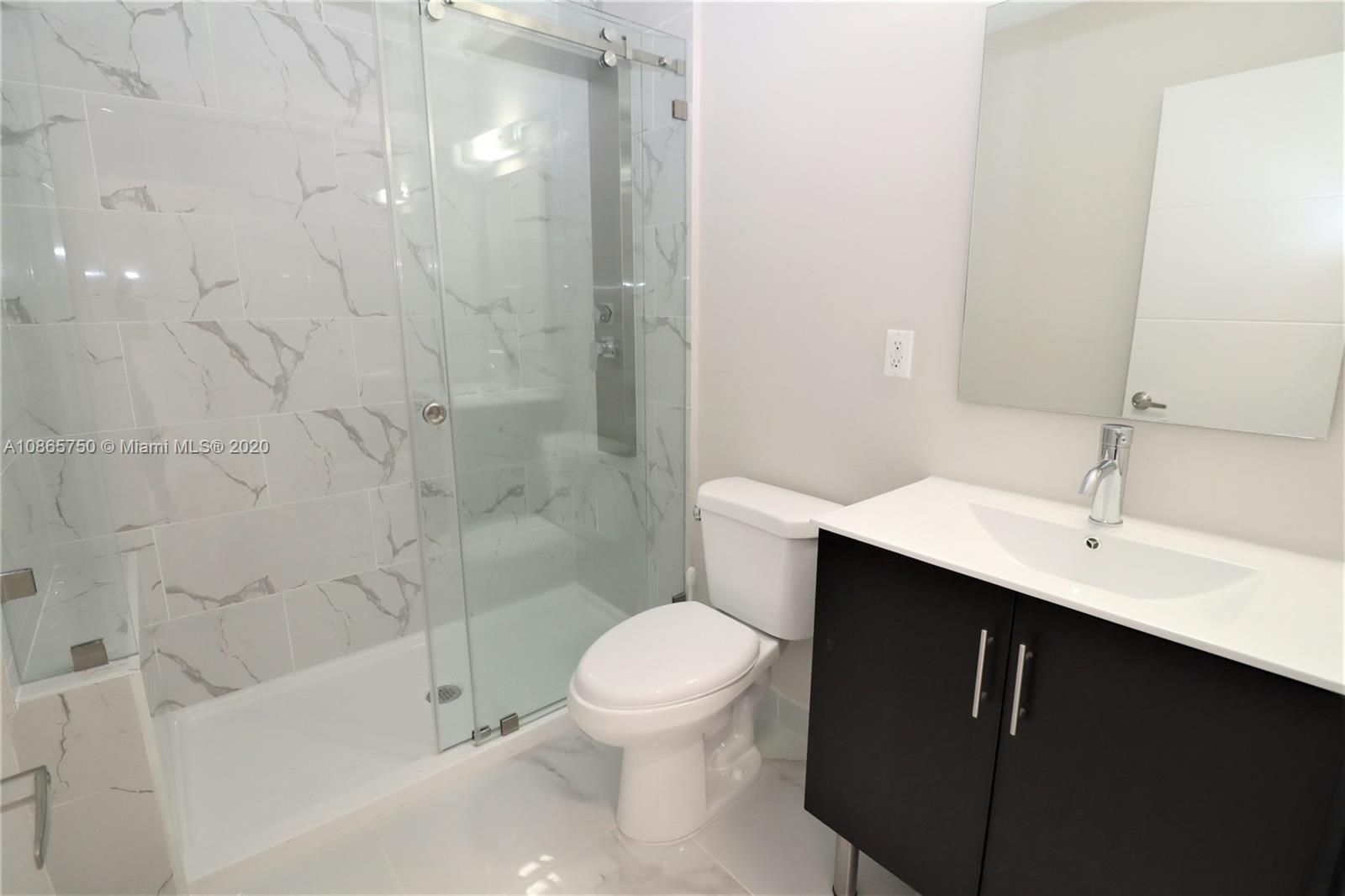 13966 Southwest 259th Terrace Homestead, FL 33032 - Photo 16 of 27 a bathroom with a sink a toilet and shower