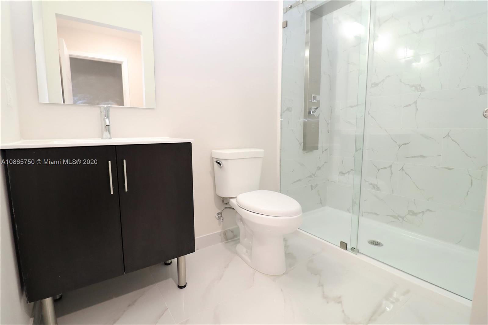 13966 Southwest 259th Terrace Homestead, FL 33032 - Photo 19 of 27 a bathroom with a sink a toilet and shower