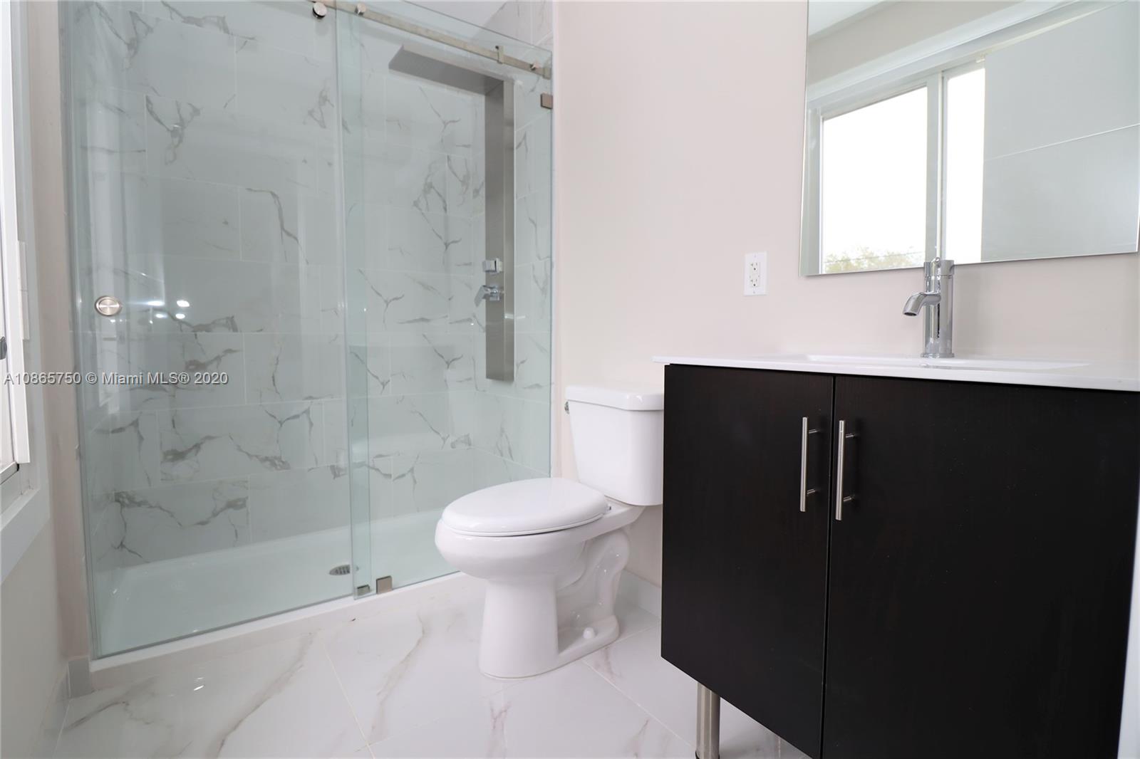 13966 Southwest 259th Terrace Homestead, FL 33032 - Photo 20 of 27 a bathroom with a sink toilet and shower