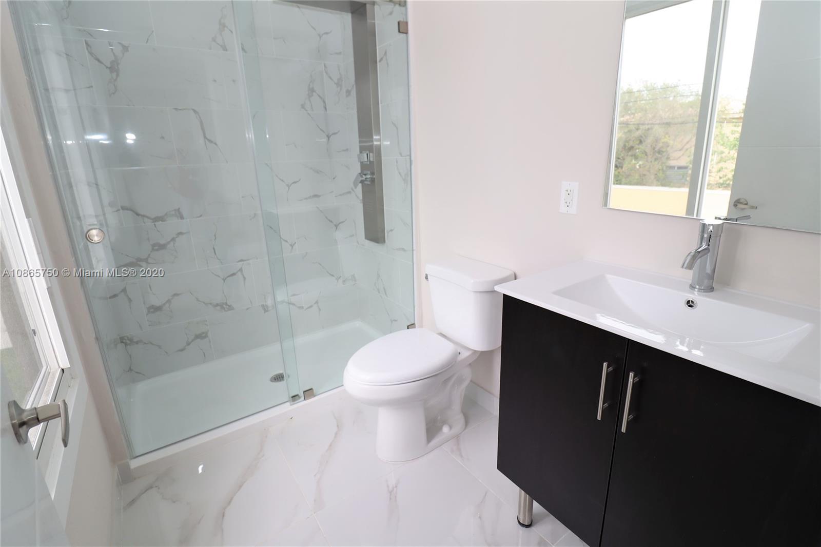13966 Southwest 259th Terrace Homestead, FL 33032 - Photo 21 of 27 a bathroom with a sink a toilet and shower