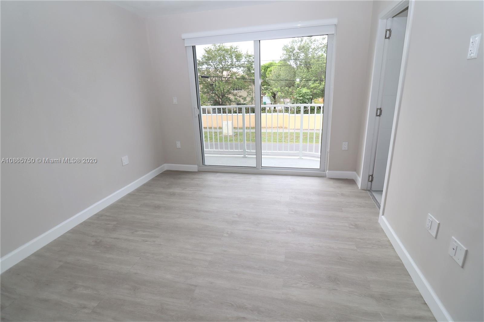 13966 Southwest 259th Terrace Homestead, FL 33032 - Photo 25 of 27 a view of an empty room with a window