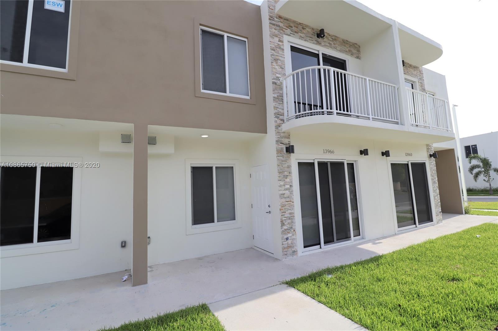 13966 Southwest 259th Terrace Homestead, FL 33032 - Photo 3 of 27 a front view of a house with a yard