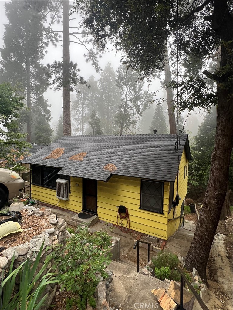 607 Seeley Way Crestline, CA 92325 - Photo 1 of 1 a front view of a house with garden