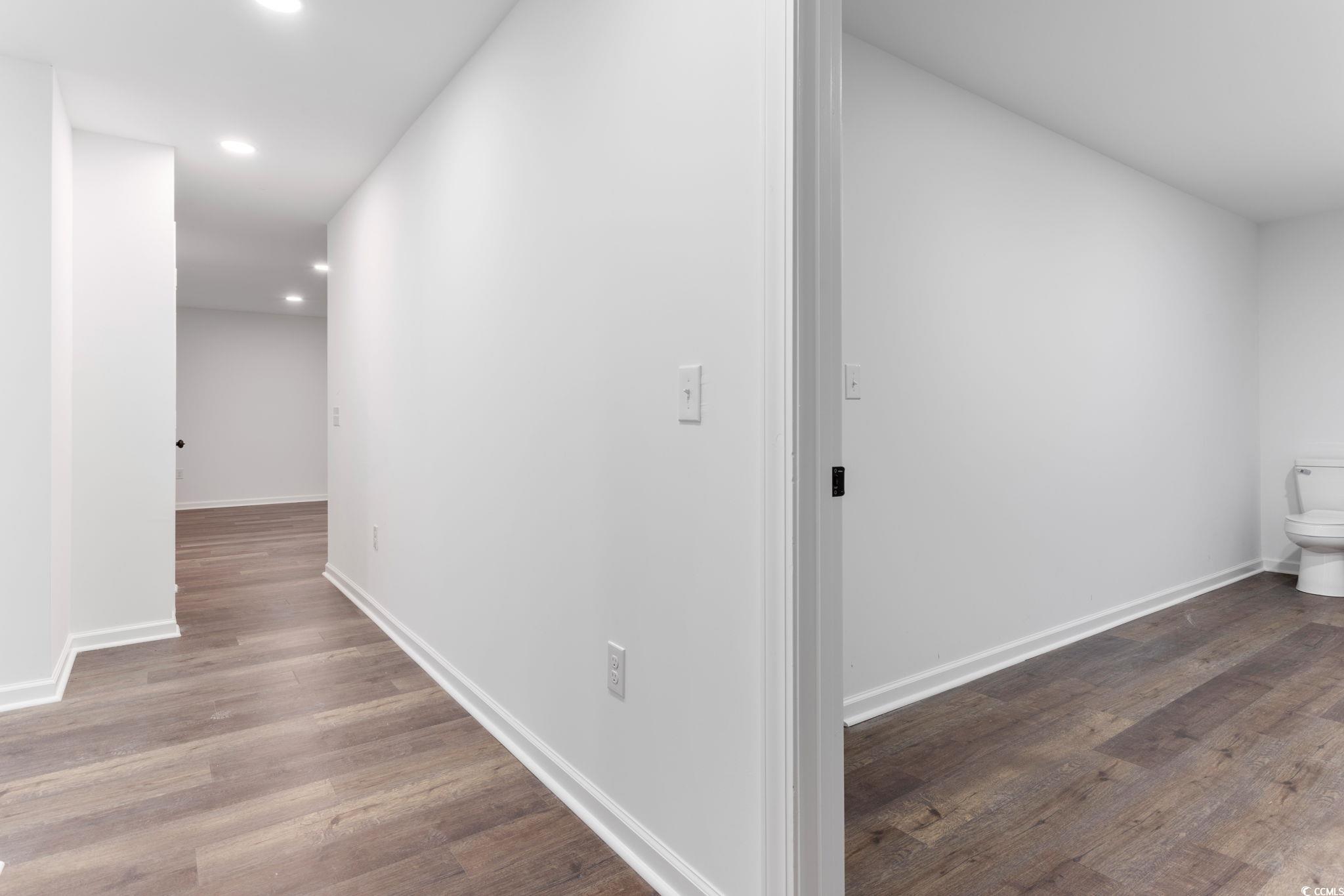 2321 Brick Drive Longs, SC 29568 - Photo 39 of 40 Hall with dark wood-style flooring and recessed lighting