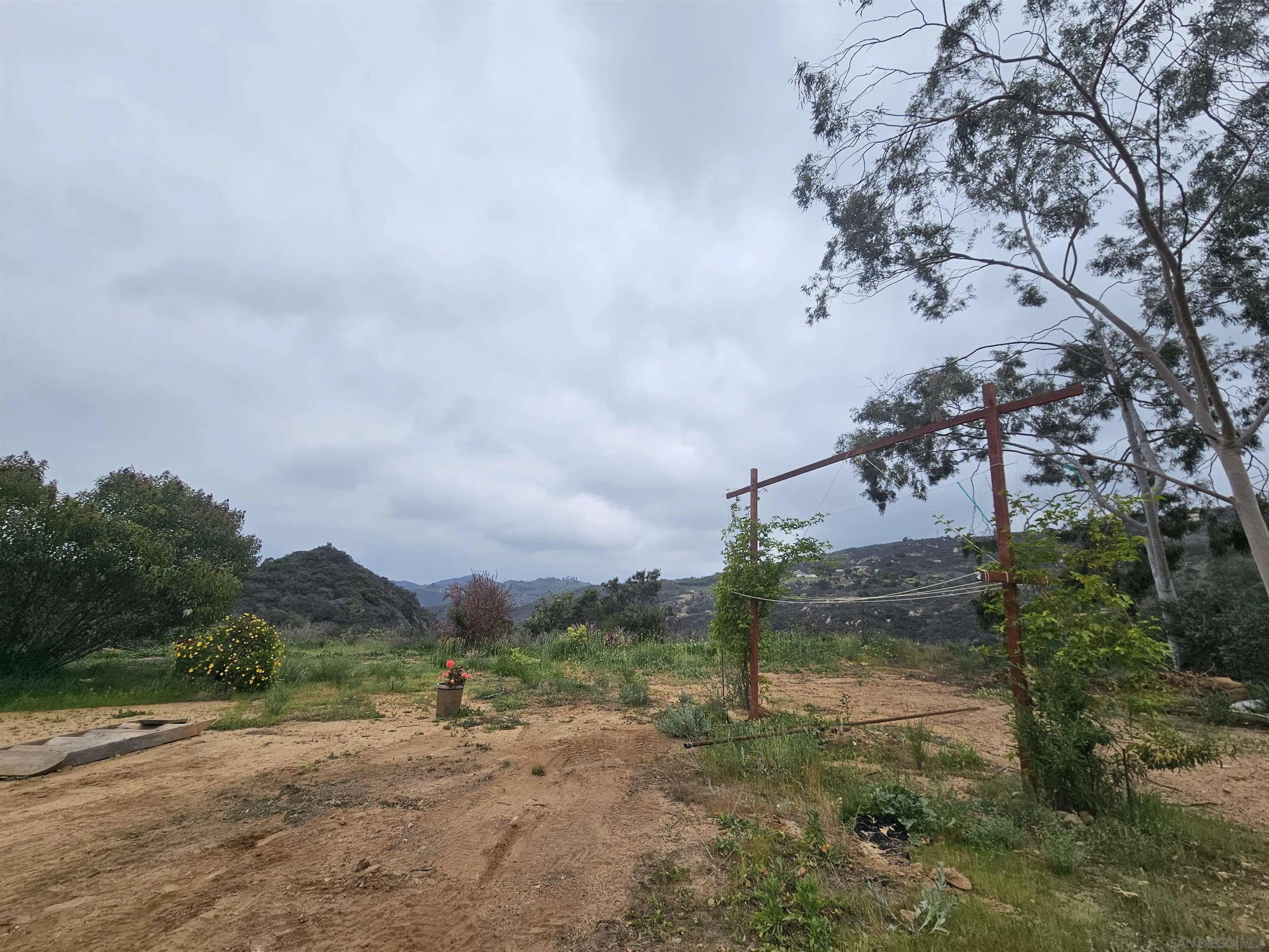 6465 Rainbow Heights Road, Unit 2 Fallbrook, CA 92028 - Photo 21 of 36 a view of a dirt road with large trees
