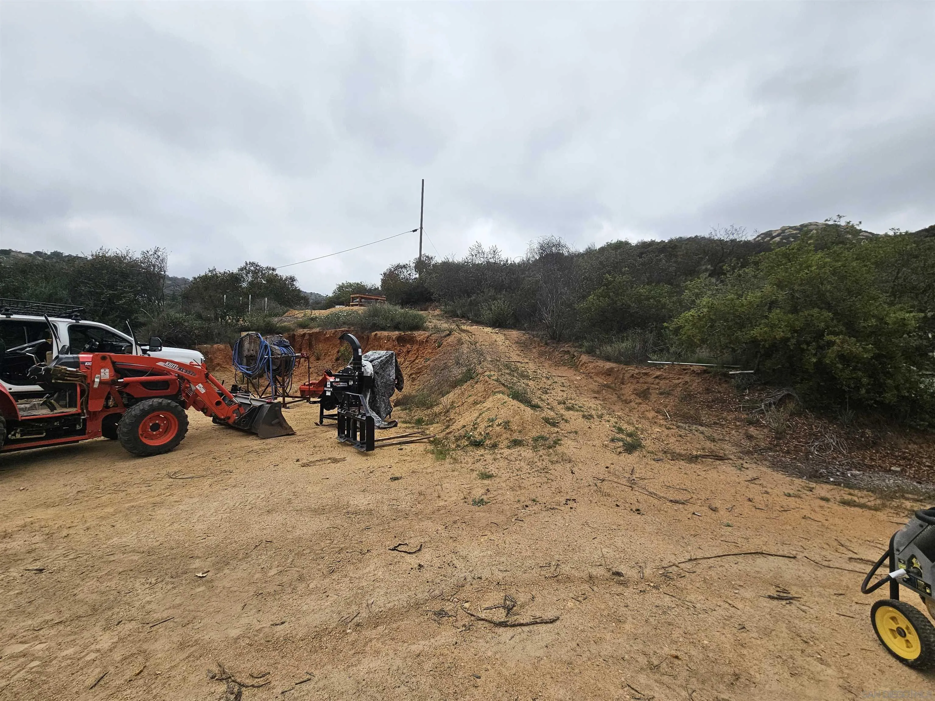 6465 Rainbow Heights Road, Unit 2 Fallbrook, CA 92028 - Photo 27 of 36 a view of a terrace with a lot of cars parked on the road