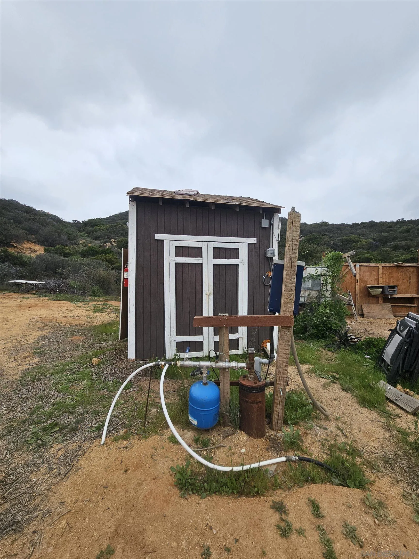 6465 Rainbow Heights Road, Unit 2 Fallbrook, CA 92028 - Photo 32 of 36 a view of a house with backyard sitting area and lake view